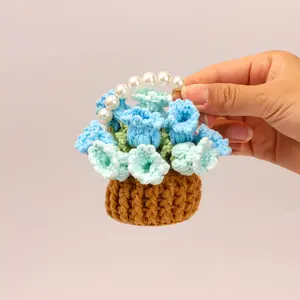 An exquisitely handcrafted, crocheted yarn mini-basket—a warm and soft home decor accent that can also be laid flat to serve as a coaster. An inspired gift idea.