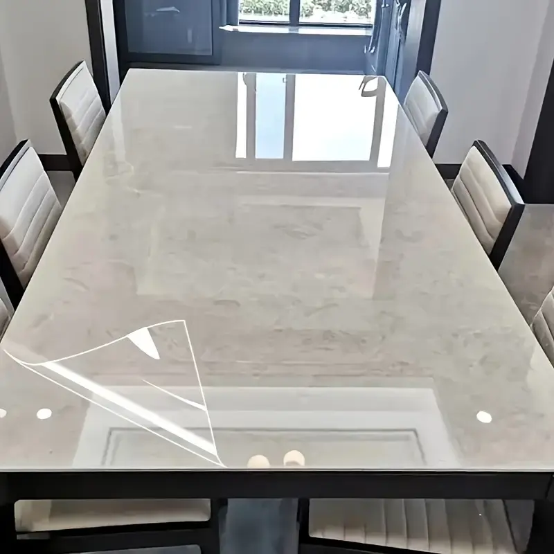 Volume 1[23.62 * 393.70 in ] , high-definition transparent film, anti-oil paste, waterproof and oil-proof, reusable, used to protect the table against scratches, applicable to dining tables, desks, living rooms, coffee tables, desks and so on