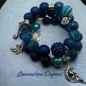 Beautiful blue beaded charm bracelet. Made with memory wire, wraps wrist twice. Fits most comfortably. Daily