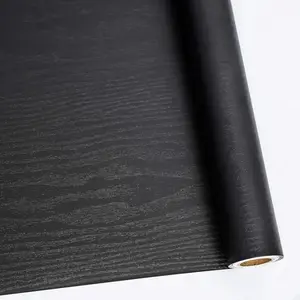 A roll of black wood grain stickers, Self Adhesive Wallpaper, waterproof and oil-proof vinyl film, suitable for kitchen, bathroom, furniture renovation, easy to paste and remove, hollow pattern, semi-gloss, self-adhesive, reusable PVC material