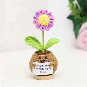 A beautifully handcrafted, crocheted wool daisy potted plant—perfect for occasions such as Mother's Day, Thanksgiving, and Teachers' Day—serving as an exquisite home decoration.