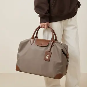 TX Packs Work-to-Weekend Crossbody, Waterproof Nylon Overnight Bag with Luggage Sleeve