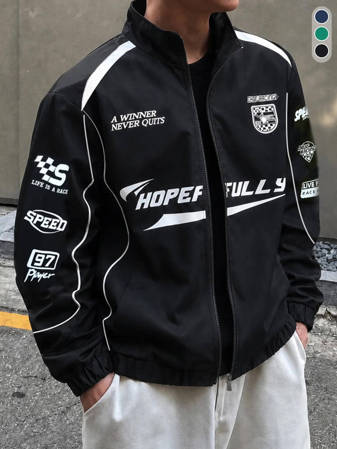 Men’s black stand-collar motorcycle jacket with a racing style, featuring multiple racing slogan and badge prints across the entire garment, a full zip front closure, elastic cuffs, and a hem with stretch; American vintage stand-collar jacket for spring a
