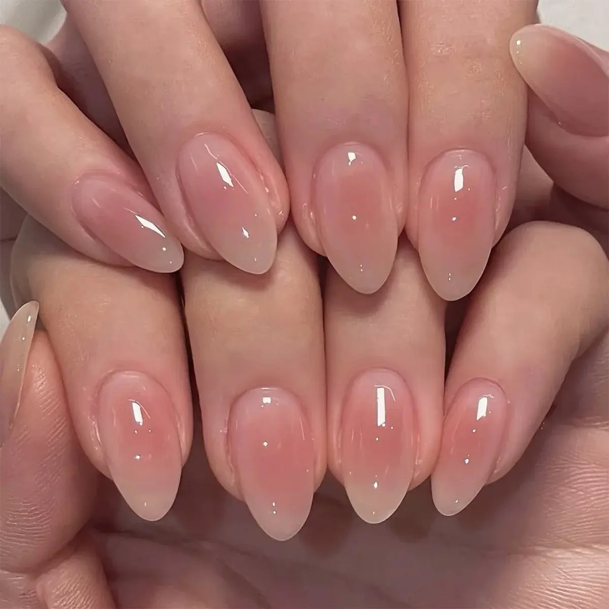 24Pcs Short Oval Head Blush Pink Press on Nails with Simple Designs Almond Nails Wearable Acrylic Full Cover Nail Tips with Glue