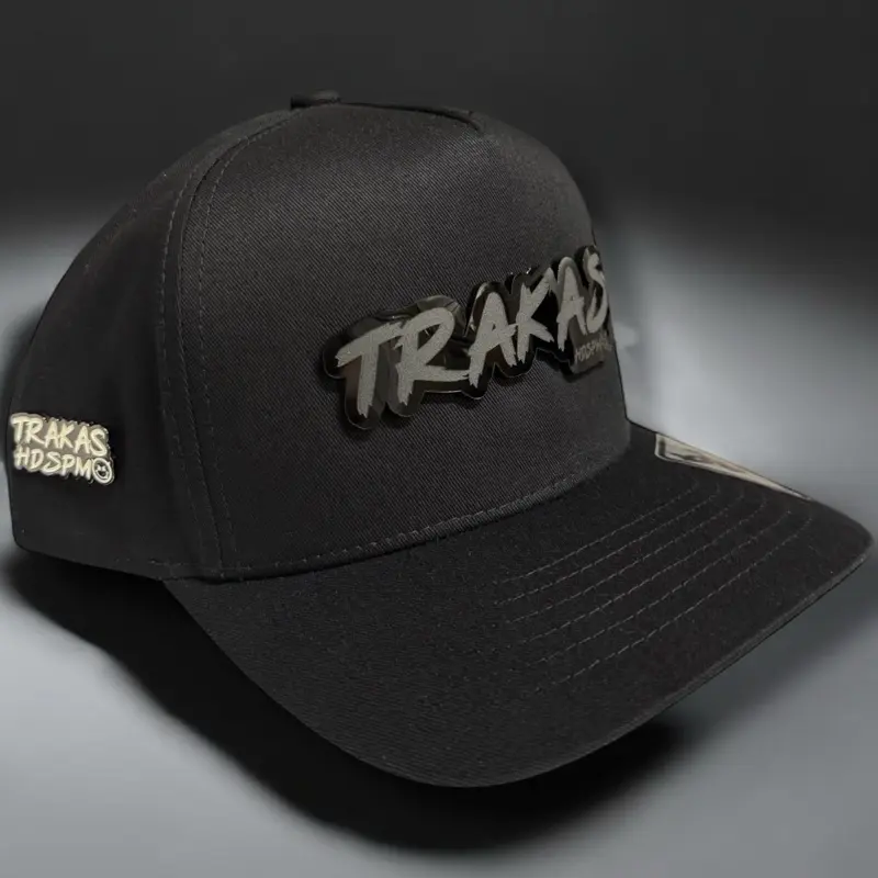 TRAKS Black Snapback Cap with Pin, Adjustable Snapback Design, Black Plaque, Comfortable Fit