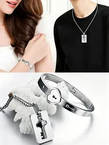 Matching Couple Heart Lock Bracelet & Key Necklace. Crafted from durable stainless steel, this set represents forever love. Perfect for anniversaries, Valentine’s Day, or showing your partner they hold the key to your heart! Matching Couple Jewelry