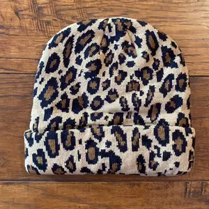 Cheetah Print Beanie - Classic Design with Beige and Black Patterns, Soft Fabric, Ideal for Cold Weather