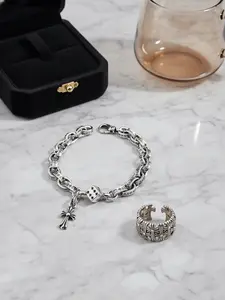 A Two-Piece Set Of Retro And Stylish Silver Cross Bracelets And Unique Punk Cross Couple Rings Is Suitable For Giving To A Loved One