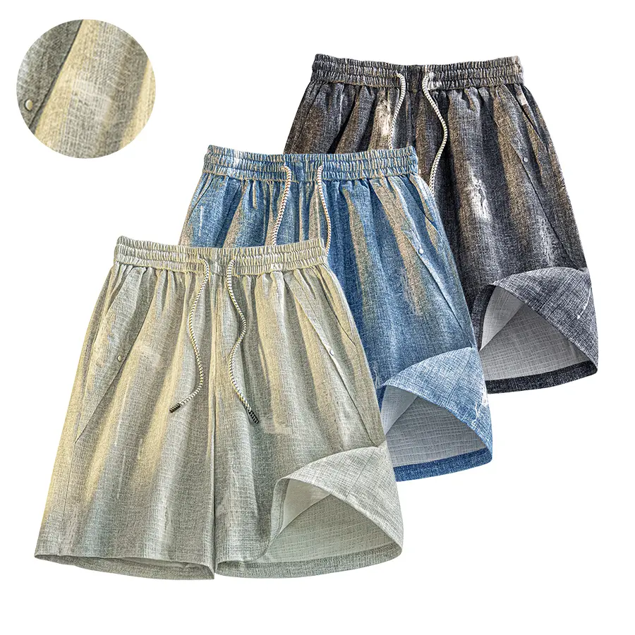 Denim-look distressed shorts with a paint-splatter texture, mid-thigh length, drawstring elastic waistband, studded accents on the sides, jacquard fabric that’s breathable and lightweight, wide loose fit for everyday versatility.