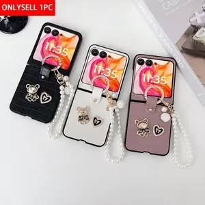 This crocodile-textured PU leather phone case Cover with a rhinestone bear ring clasp comes with a bracelet and is compatible with Motorola Razr Plus 2023, Razr 40 Ultra, Razr 2024, Razr 50, Razr 2025, Razr 60, Razr Ultra 2025, and Razr 60 Ultra.