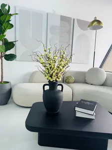 PLUM BLOSSOM IN BLACK CERAMIC VASE