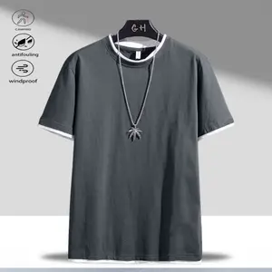 Men's deep gray short-sleeve T-shirt with stylish casual flair features white trim for added detail; pairs well with personalized necklace for an extra fashionable look, perfect for men who love casual style