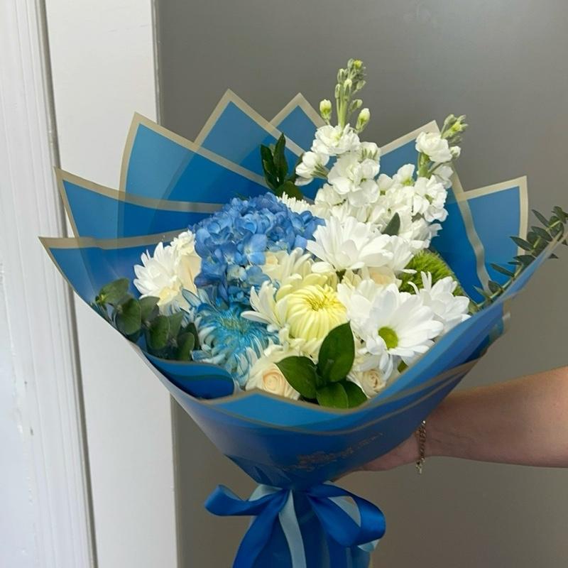 Blue Ocean Bouquet with Blue Hydrangeas White Chrysanthemums and Greenery in Blue Packaging