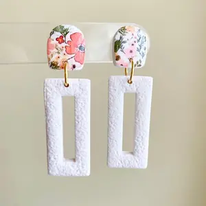 Springtime floral pattern and textured white polymer clay dangle earrings