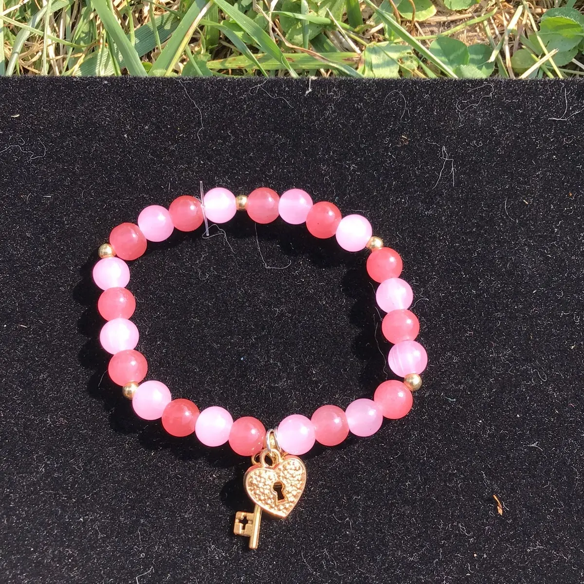 Pink and white charm bracelet