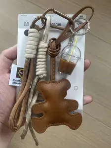 PU Little Bear Milk Tea Cup Keychain Set, Ins-Style Handmade Woven Lanyard Keychain, Cute Charms Keychain, featuring vintage color scheme, paired with PU little bear and realistic milk tea cup, a cute accessory for everyday commuting or date outfits