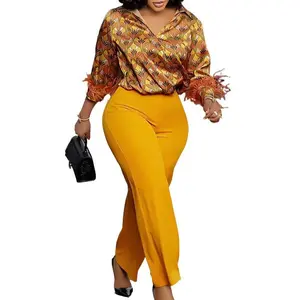Women’s red lace printed long-sleeve shirt and wide-leg pants, styled with an elegant and fashionable African look, suitable for formal occasions.