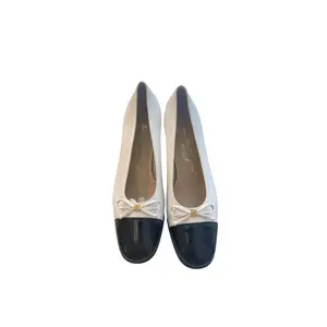 Salvatore Ferragamo | White w/ Black Toes & Bow Accent (Vintage)