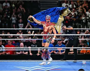 El Grande Americano WWE Unsigned In-Ring Entrance with Cape Photograph