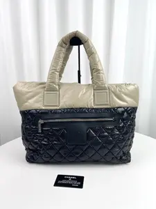 Pre-owned CHANEL Genuine Leather Tote Bags 	Chanel Coco Cocoon Black & Beige Quilted Nylon Tote Handbag
