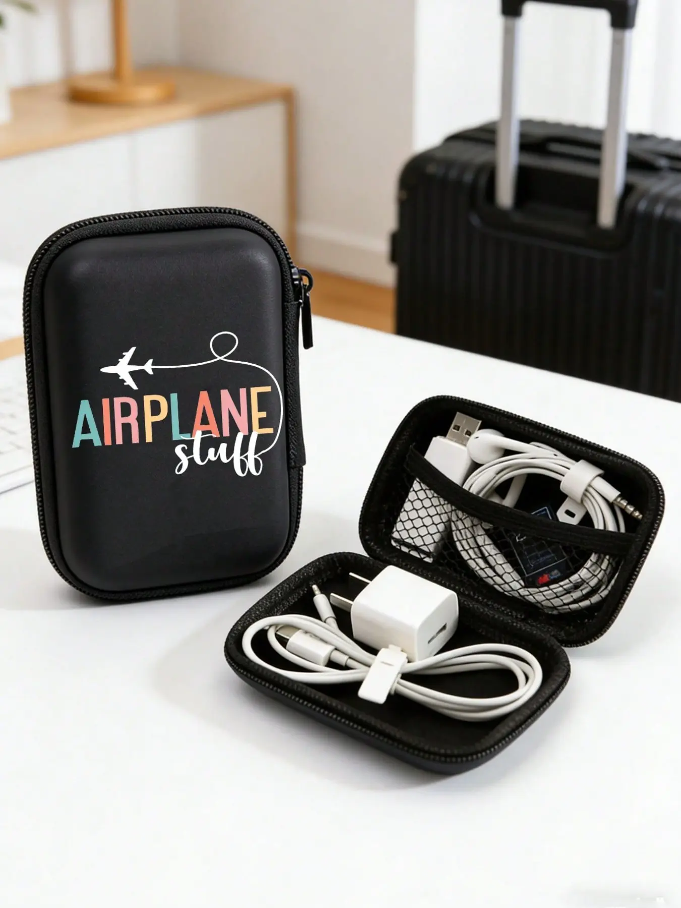 Compact storage pouch with an 'AIRPLANE STUFF' logo print, made of durable EVA hard shell, suitable for electronic accessories, headphones, hard drives, data cables, cards, and playing cards