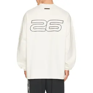 Fear of God ESSENTIALS 90'S Long Sleeve Tee in Ivory Fear of God ESSENTIALS 90'S Long Sleeve Tee in Ivory