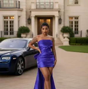 Elegant Purple Strapless Dress with Matching Silver Handbag for Formal Events