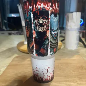 Horror Characters 40oz Tumbler with Graphic Design of Blood Splatters and Iconic Characters