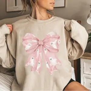 Pink Ghost Bow Sweatshirt, Kawaii Ghost Bow Graphic Tee, Pastel Goth Ghost Bow T-Shirt, Cute Halloween Bow Sweatshirt, Ghost Bow Graphic Sweater, Vintage Ghost Bow Graphic Shirt, Halloween Bow and Ghost Print Shirt, Spooky Cute Bow Graphic T-Shirt
