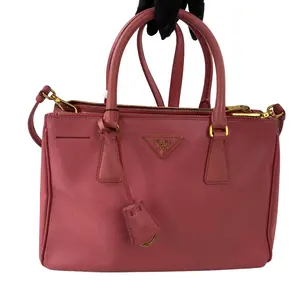 Pre-owned PRADA Saffiano leather with gold-tone metal hardware Tote Bags .Prada pink Saffiano leather small top handle bag with detachable shoulder strap.+little charm++