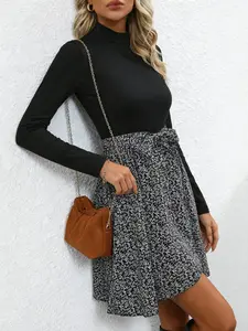 A fashionable women's black and white spliced high neck dress with layered design and a high waisted tie for commuting, shopping, and outdoor wear