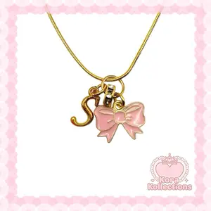 handmade gold princess initial charm necklace by kora kollections with plated chain