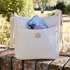 Bethany Crossbody Cream Handbag with Gold Logo Detail and Adjustable Strap for Everyday Use