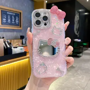 New Rhinestone Bow Tie Shell-Patterned KT Cat Glass Mirror Phone Case For iPhone 16 15 14 13 12 Pro Max – Heart-Shaped Prismatic Protective Case