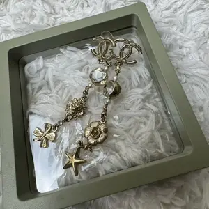 Pre-owned CHANEL Metal Bag Accessories vintage lion, clover, and star charm earrings
