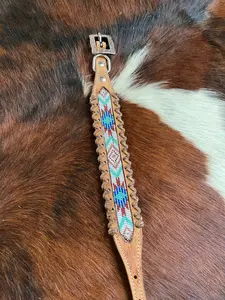 Genuine leather dog collar with white, teal, and burgundy southwest beaded inlay designa leather wrapped edge and copper hardware.