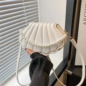 Shell-Shaped Crossbody Bag – Pearl Trim, Compact Chic