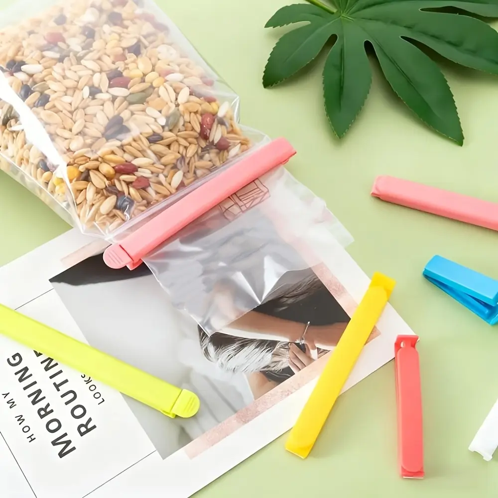 Set of 27 Reusable Clips for Sealing Food Bags, Ideal for Potato Chips And Bread. These Kitchen Storage Additions Feature a User-Friendly V-Shaped Design That Protects Against Moisture And Dust, Ensuring Your Food Stays Fresh
