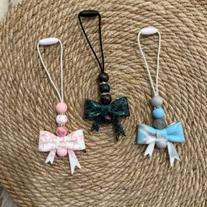 Bow Car Charm - Live Claim