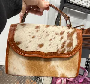 Genuine hand tooled leather & cowhide handbag/crossbody bag with tooled bottom and sides