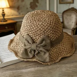 Versatile retro woven handmade straw hat with ruffled bow, elegant French sun hat, foldable, breathable travel beach hat.
