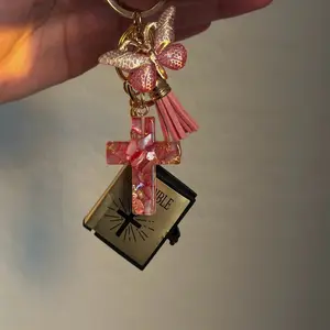 Cross Key Chain with Pink Tassel and Butterfly Charm for Stylish Accessory