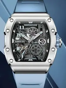 Black skeleton dial, rectangular white bezel, blue rubber strap, automatic mechanical watch