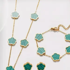 Green Clover Charmed Jewelry Set with Gold-Tone Beads and Decorative Elements