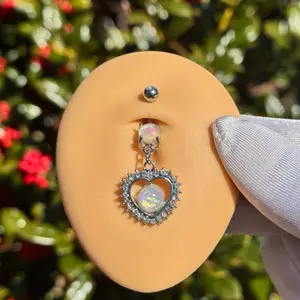 Heart belly ring piercing