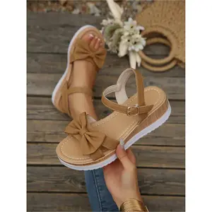 Women's new plus-size hollow-out buckle bow-decorated round-toe wedge sandals for outdoor wear, stylish, simple, comfortable, lightweight, suitable for daily commuting, with a thick sole Boho Style Wedge Boho Sandals, Affordable Sandals, Footwear