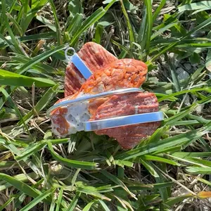 Wire Wrapped Shell Pendant - Orange Shell with Silver Wire Accent in Natural Setting