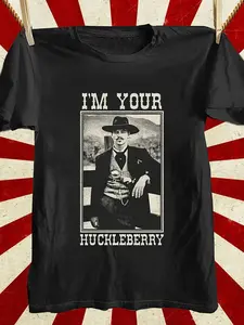 Graphic T-Shirt Featuring 'I'M Your Huckleberry' - Striking White Typography on a Black Tee with Retro Photo Design And Distinctive Sunburst Backdrop - Perfect Casual Attire for Outdoor Lovers And C Enthusiasts