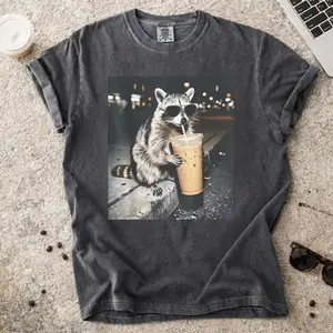 [Sale up to 50%] Comfort Colors Raccoon meme shirt, Raccoon Drinking Iced Coffee tee, Funny Animal Meme T shirt, Coffee Lover Raccoon Shirt, Gift For Women Unisex T-Shirt, gifts for boyfriend