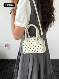 Retro style polka dot printed mini handbag with detachable shoulder strap and polka dot print, capable of holding mobile phones, lipstick, and personal items. It is versatile and suitable for both dates and daily commuting